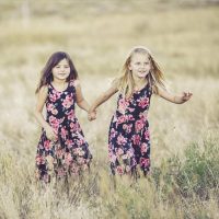 sydney two girls running through long grass wearing naturalvue contact lenses or orthokeratology